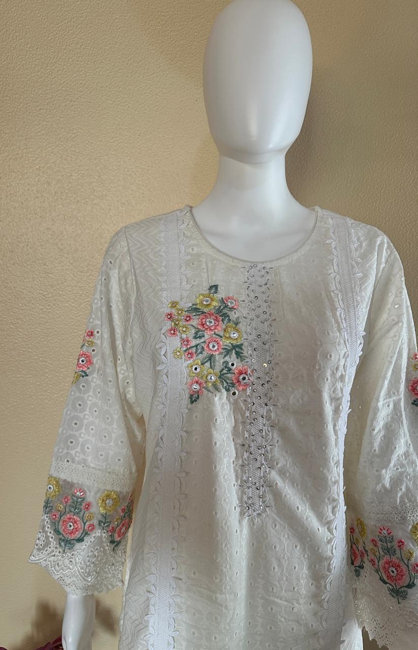 White suit with floral embroidery and net