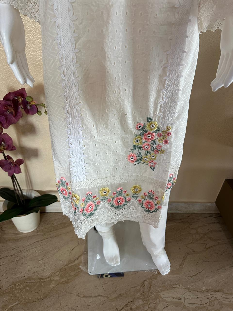 White suit with floral embroidery and net