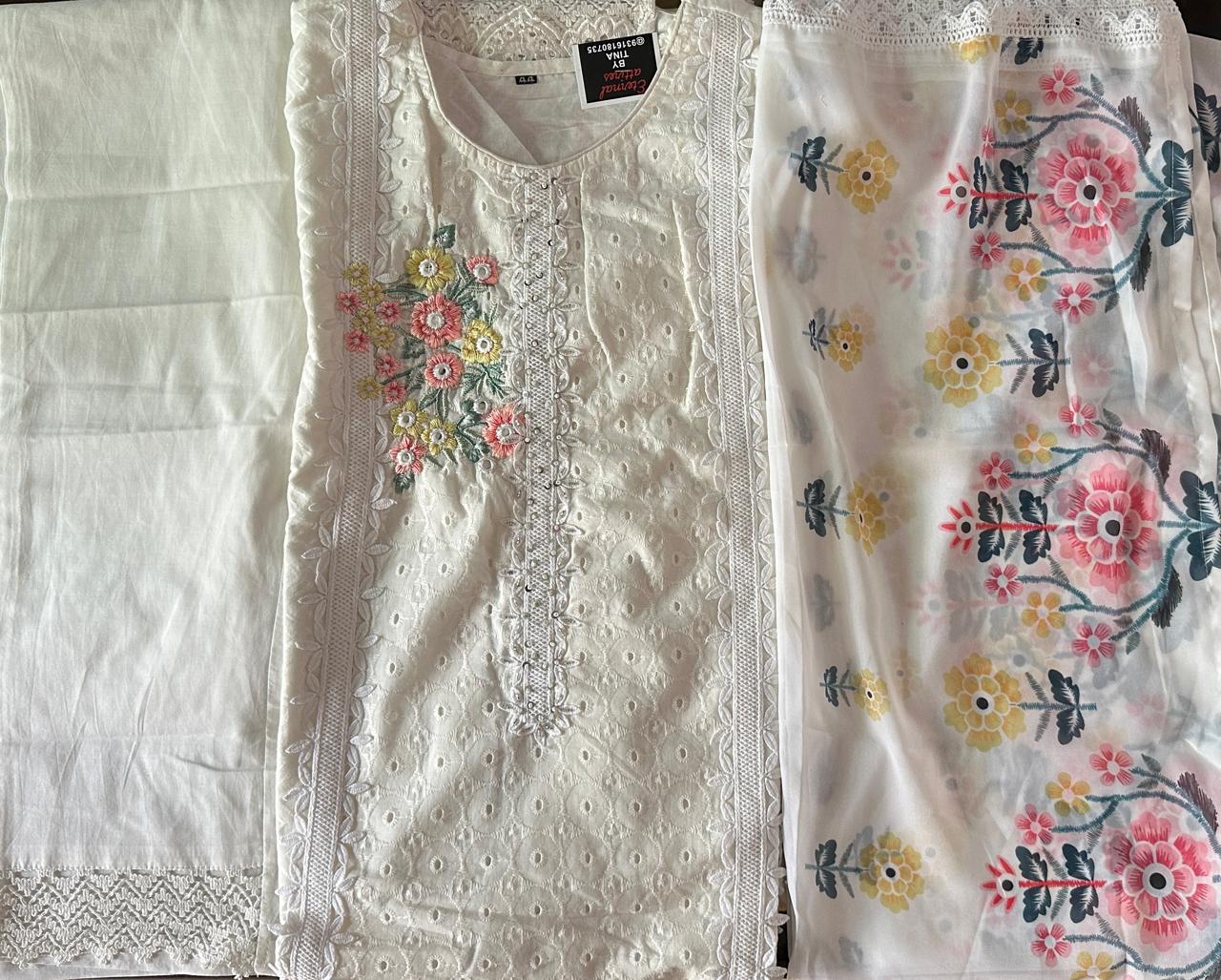 White suit with floral embroidery and net