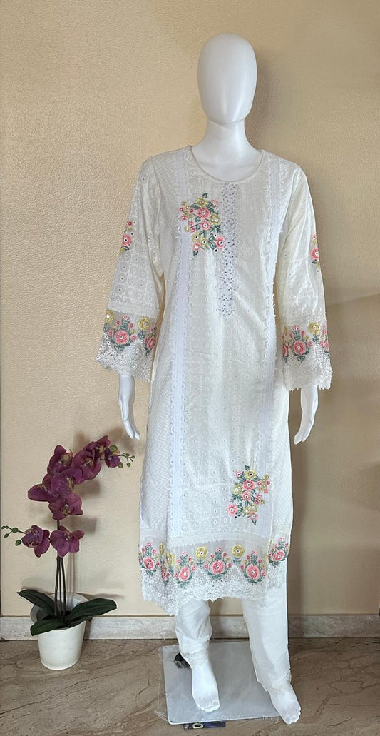 White suit with floral embroidery and net