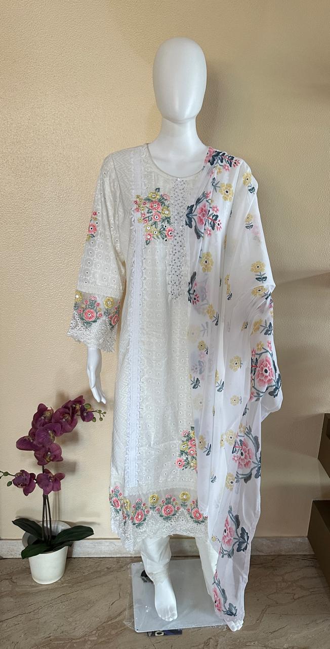 White suit with floral embroidery and net