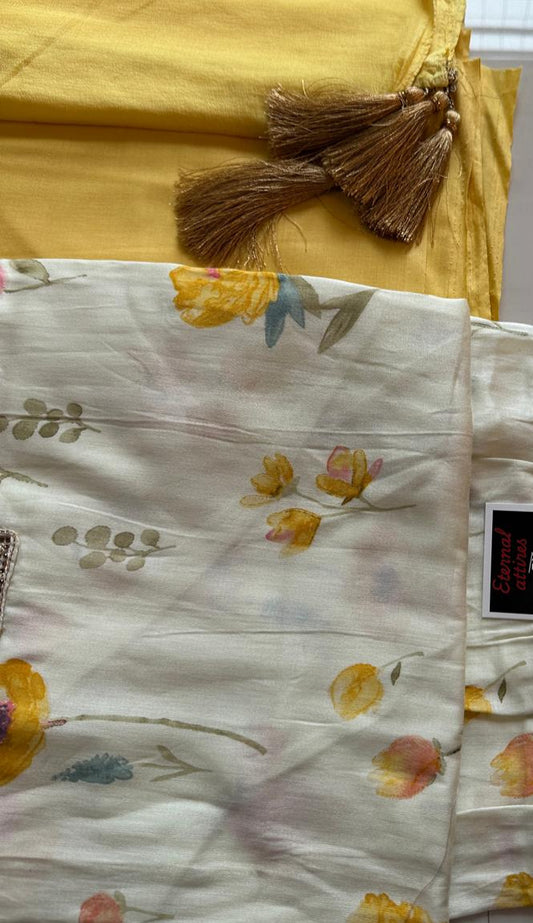 Floral-patterned fabric with tassels on a yellow background